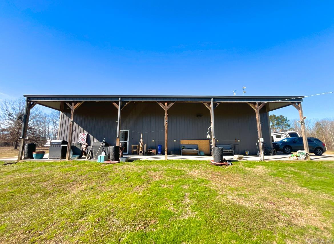 Discover the charm of rural living with this unique 2-bedroom, 2-bathroom barndominium nestled on 8.7 acres in beautiful Arkadelphia. Perfect for those seeking tranquility, this property boasts a serene pond, a 2-car garage, and two oversized storage buildings. The home includes a workshop with a loft aboveāideal for hobbies, storage, or additional living space. While some areas of the home remain unfinished, materials will convey, allowing the new owner to complete the space to their liking. Solar panels (paid off) and a generator that conveys provide sustainable energy and peace of mind. The master suite is a true retreat, featuring a luxurious Jacuzzi tub and a spacious walk-in shower. Outdoors, the expansive acreage offers endless possibilities for recreation, gardening, or simply enjoying nature.Also located on the property are two storm cellars so you're protected during disastrous season. This home is located in a flood zone, but the seller has affordable flood insurance that theyāre happy to share. Donāt miss this rare opportunity to own a versatile property that combines country living with modern convenience. Schedule your showing today!