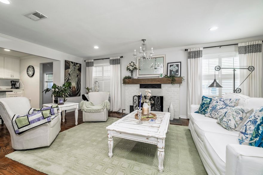 Welcome to this beautifully maintained and thoughtfully updated home situated on a rare, full acre lot in the heart of Arkadelphia. Offering space, charm, and functionality, this property blends classic character with modern comforts in a highly desirable location.  Inside, you’ll find inviting living spaces with hardwood flooring, crown molding, abundant natural light, and a stunning fireplace that anchors the main living area. The updated kitchen features ample cabinetry, stainless appliances, a large island, and flows seamlessly into the dining and living areas—perfect for everyday living and entertaining. Multiple living areas and a bright sunroom provide flexibility for relaxing, hosting, or working from home.  The spacious primary suite offers a peaceful retreat with elegant finishes, generous closet space, and a spa-like bath complete with soaking tub. Additional bedrooms are well-sized and thoughtfully designed. Step outside to enjoy the expansive yard with mature trees, decking, and room to garden, entertain, or simply enjoy the privacy rarely found this close to town.