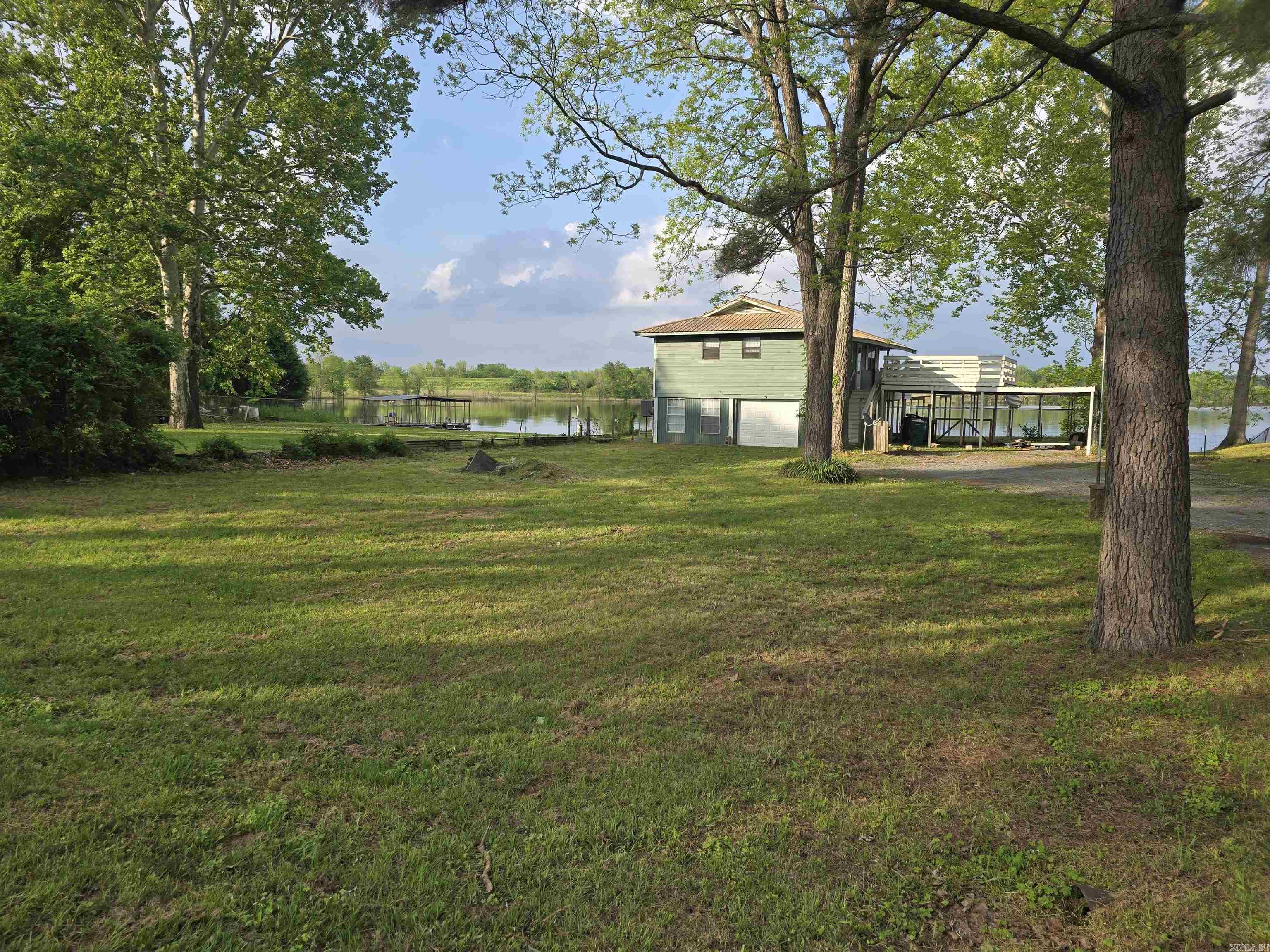 Riverfront Living at Its Best! This elevated 2-bedroom, 1-bath home sits right on the beautiful Arkansas River, offering unbeatable views and exceptional fishing right from your backyard. Underneath, youāll find a spacious garage, while the home above features newer luxury vinyl plank flooring, fresh cabinets, and warm butcher block countertops accented by a stylish subway tile backsplash. All appliancesāincluding the refrigerator, stove, washer, and dryerāstay with the home. Enjoy the outdoors on the upper-level deck above the metal carport or entertain on the large, covered dock complete with lighting for nighttime relaxation. With central heat and air and thoughtful upgrades throughout, this property would make a perfect primary residence or a high-demand rental. Donāt miss your chance to own a slice of riverfront paradise!
