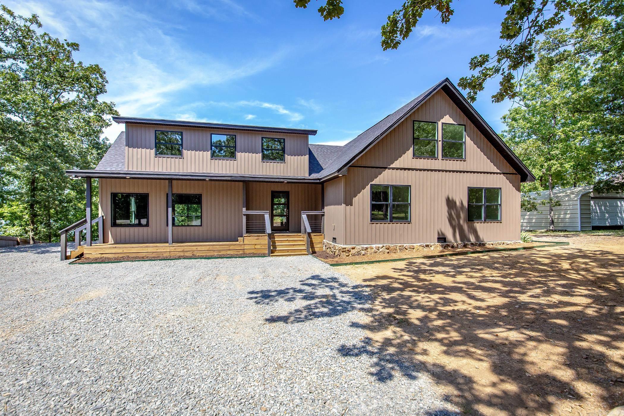 Completed gutted, added onto, & remodeled to look like a New House Again! 4 Bedrooms, Gameroom off of the kitchen downstairs, plus a Large bunk room upstairs. Approx. 3.8 miles to Sugarloaf Marina (Lake Cliff is a gravel road). Brand New water heater (gas-runs off propane), All new Kitchen Appliances (Gas stove, refrigerator, dishwasher, & microwave) , New Roof , Two New HVAC systems (All Electric except when temps get below 30 degrees, the backup propane heat kicks in), & One New Mini-Split unit for Bunk Room (6 Built in twin beds). Seasonal Lake View, Back deck the full length of the home with a spacious Covered area to host plenty of company. Main level has 1/2 bath off kitchen, Two Bedrooms & a full bath off the hallway. Upstairs has two more guest bedrooms, a full bathroom, & the Bunk Room.
