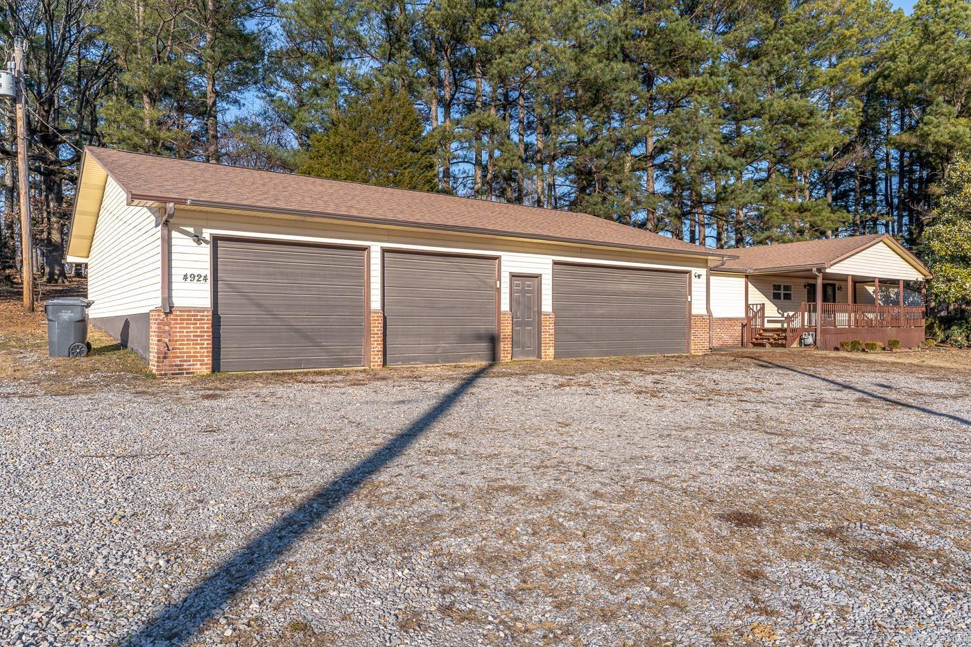 Welcome to Market 4924 Peachtree Avenue of Jonesboro, Arkansas within the Brookland School District. Situated on 3 +/- fenced and level acres sprinkled with mature shade trees, is a Ranch Rambler wrapped in brick and vinyl, topped with architectural shingles and accented by a 4 car garage/shop with storage rooms, cozy front porch, deck that spans the back exterior, 2 storage rooms, and guttering. The interior contains 2,676 sf of well laid out living space that contains an eat-in kitchen with bar and island seating, stainless steel appliances, and double oven, dining area, large living room with access to the back deck, 4 generous bedrooms with large closets, 4 full bathrooms, and large laundry/utility room. Improvements to the property include: roof, appliances, and flooring. You'll the jet tub, walk-in shower, ample space to spread out in and scenic views. Conveniently located near 49 N and favorite local amenities such as NEA Baptist Memorial Hospital, Arkansas State University, and favorite local retail and dining establishments. Call today to schedule your tour and make this house your home.