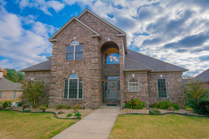 Amazing Space in this 4 bedroom 3.5 bath home.  Warm inviting home opens to formal dining room, grand stair case into living room containing a double sided fire place.  Just beyond is the hearth room or additional den area, and kitchen with a feature wood slat ceiling, stainless appliances, 2 ovens, gas cooktop and breakfast bar and eat in kitchen.  Large Primary suite contains sunken corner jetted tub, double vanity and walk in shower.  Upstairs contains guest suite with private bath, and two additional bedrooms and full bath. All rooms have walk in closets. 3 car side load, garage, large driveway and a large backyard with additional storage building and a covered/uncovered patio.  Additional features include: a central vac and built in safe Hidden under the stair case.  Don't miss this great space and great location.