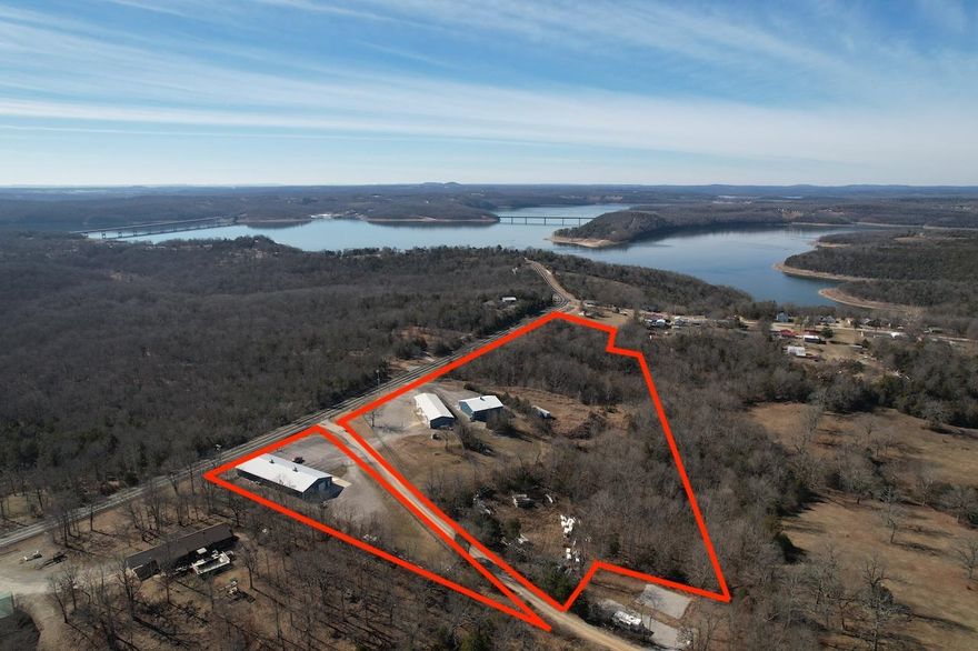 Commercial Opportunity in Henderson AR close to Norfork Lake and Mountain Home AR. The property has over 1,100 feet of frontage on highway 62/412 and is approximately 1 mile to the Henderson Bridge over Norfork Lake. There are 3 buildings, 2 wells, 2 septic systems and 2 electric services, there are 3 sections under high chain link with locked gates. The 13 acres also comes with a set of billboards that have 2 faces in each direction. 50x130 or 6500 sq ft, 2x6 wood framed with spray foam insulation it has zoned HVAC with 2 heat pump units. Formerly a Jet Ski dealer, it has a 5000 sq ft show room with 3 offices, 2 public rest rooms a service desk all nicely finished out with Pine and tin. 40x120 or 4,800 sq ft with wood framing and batt insulation it is partitioned into 3 areas: 2 shop areas both finished on the interior with white metal, air compressor included. The third section was a 1 bedroom, 1 bath studio in the past it needs some finish to taste work and has loft type storage. 60x60 or 3,600 sq ft. 2x6 wood framed with spray foam insulation with three garage doors one is 14x14 others 14x12, heat pump, 3/4 bath. Owner Financing call for terms.