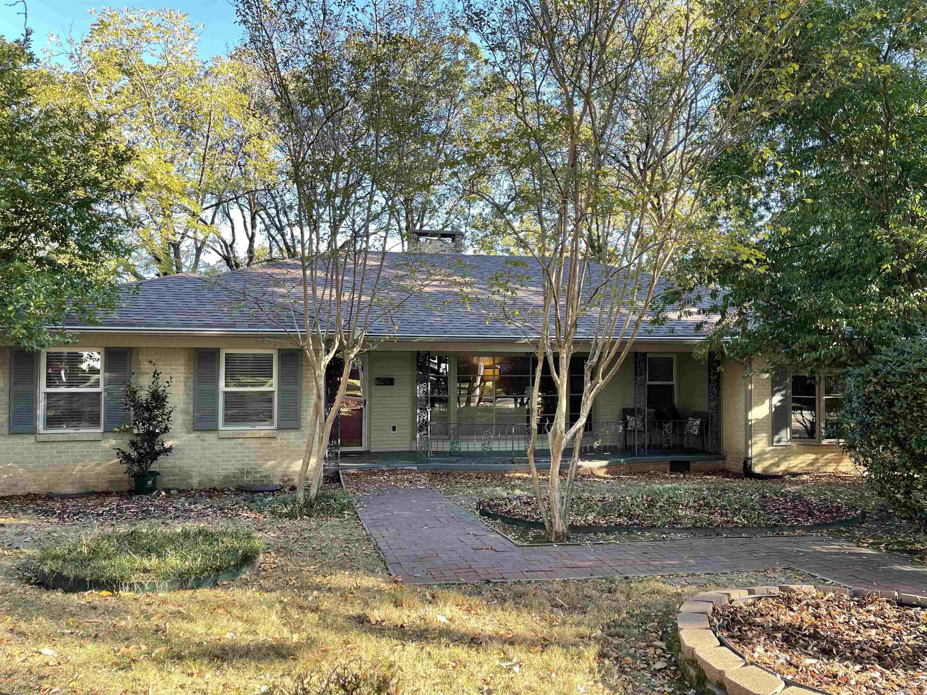 Rare opportunity to buy a large home in the Heights neighborhood and add your personal style. Great bones. Lots of room. Don't let the view from the street fool you. This home is larger than it looks. Entertain family and friends for all occasions. Versatile floor plan, with 4 possible areas to entertain inside, plus a covered front porch and deck in back yard. 2 bedrooms & bathrooms, formal living room with fireplace, eat-in kitchen or upstairs den, dining room or office on main level. 3 bedrooms and 1 bath, spacious den with second fireplace and library on lower level. Fenced in backyard with additional rear entry parking.