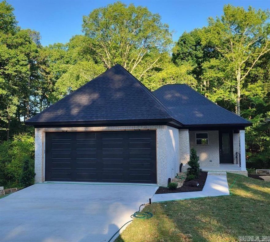 A brand new home for the new year!!   This new construction home will have top of the line finishes, and quality will abound.  The great room is large and has an  open floor plan concept.   The primary bedroom is  apart for privacy.  It has a gourmet kitchen that is spacious and  great for entertaining.  Wonderful fireplace for those chilly days and nights of winter.  Tankless hot water heater, exterior gutters and no maintenance exterior.   Great price for quality new construction!   The  lot is 155 feet deep.   There are no HOA fees. or Special Improvement Taxes on this home! Country setting in the heart of west little rock.  It's located a few minutes from the Promenade at Chenal shopping center and everything WLR has to offer!!!  Don't snooze and lose on this one!  **PICTURES 19-33** are of a different home with similar finishes that this house will have.  see associated docs for floor plan.  Taking back -up offers!