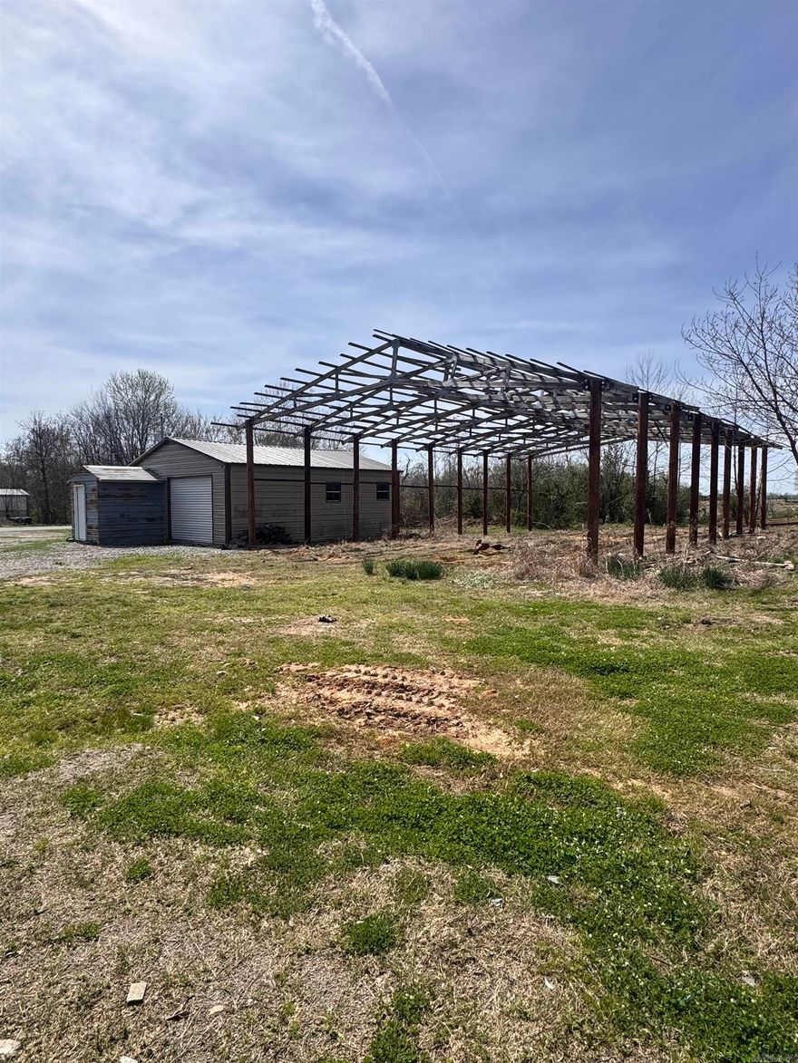 This mixed use property features a 1 bedroom residential investment opportunity along with a 24x30 commercially zoned shop with electric , dual overhead doors and an office. Also on the property is a newly framed 40x60 structure ready for your finishing touches!  Agents see remarks