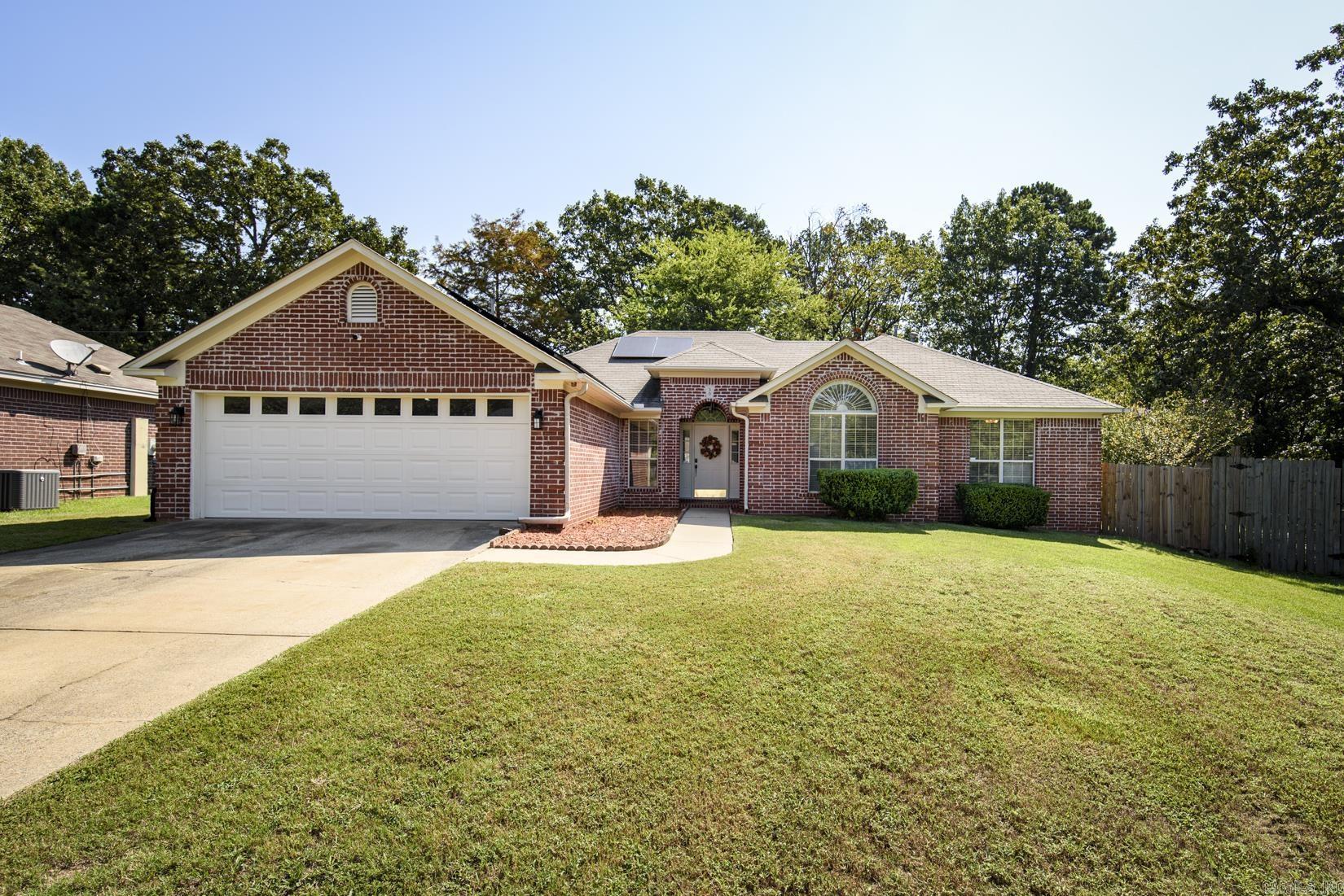 Energy efficient, move in ready & packed with upgrades! Conveniently located with quick access to I-40, tucked away in a cove just 1.5 miles from Maumelle Boulevard and/or the Bid Dam Bridge! It's move-in ready with countless upgrades, blending peace of mind and modern comforts! Recent improvements include new roof, solar panels for energy efficiency, new gutters, new water heater, new HVAC system, new furnace, new fence, new deck & new electric panel. Inside you will enjoy the newer flooring, newer appliances, blinds, vented gas logs for the fireplace, security system with cameras and most of all the newly added on sunroom! Don't miss your chance to make it yours!