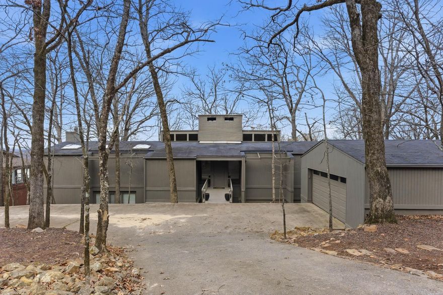 Experience stunning river views in this soft contemporary home located in the coveted Overlook Park area, close to Heights shopping and restaurants and a short walk to the river biking trails and Murry Park. The main level living area has hardwoods, a fireplace, formal dining and expansive floor to ceiling windows that flood the home with natural light. The kitchen is thoughtfully designed for everyday living and family gatherings with easy access to the deck, large walk-in pantry, abundant storage and an oversized laundry room that offers extra space for additional refrigerator or freezer. Enjoy relaxing or entertaining on the expansive upper and lower decks that are accessible from almost every room. The main level master suite includes his and her closets, a sitting area with fireplace, vaulted ceiling and a private deck. Downstairs is a spacious second living area that includes 3 bedrooms, 2 full baths, den with fireplace and wet bar. Home also features a heated and cooled workshop-ideal for hobbies or home projects and a generator for peace of mind. New carpet in 2025. Pool table has been professionally disassembled and can covey if buyer is interested.See agent remarks.