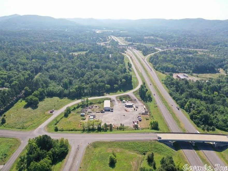 Great Opportunity for Commercial Development!!  High traffic visibility, Road frontage on ALL sides, Westinghouse exit, Near Magic Springs Theme Park and the Gateway to Hot Springs National Park.  Value is in the land.