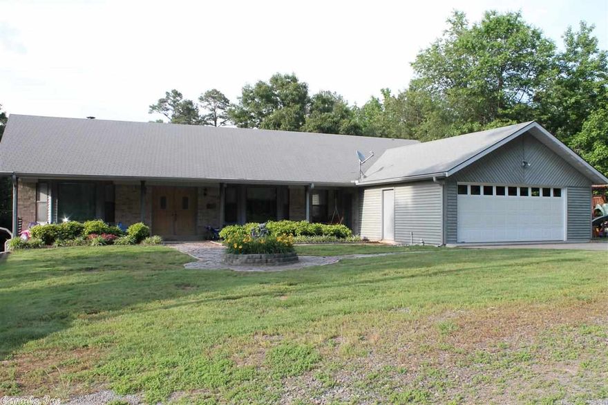 Gorgeous Lakefront home with lots of room!! Easy access to water in back yard. Large deck in back of house with patios. Bay window in formal dining room. Large bedrooms through out. Has partial basement with entry outside but it is heated and cool. Seller Motivated!!!