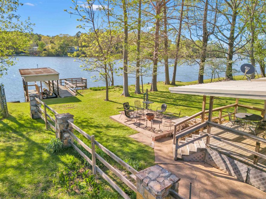 This remodeled lake front home has an extensive feature list! Enjoy 66' lake front on Harris Brake Lake, the largest lake owned by the Arkansas Game and Fish Commission! The home itself features 3 bedrooms, 2 bathrooms and a huge garage/shop! ALL FURNISHINGS CONVEY! The boat slip + dock has been grandfathered in on its length and is 85' long!! The 1,108 sq/ft garage+shop features an Artesian well, electrical, plumbing (currently a sink and washing machine inside), cedar lined closet, workshop with benches and storage! HVAC 2022, water heater 2019, metal roof, new gas line 2017, new painted exterior 2024, soffit upgraded to metal 2024, paved driveway. This home is currently being used as a short-term rental, which profits $14-18k/year. This could be increased easily and is a turn-key short term rental property! There are so many features about this home you will want to come see it in person!