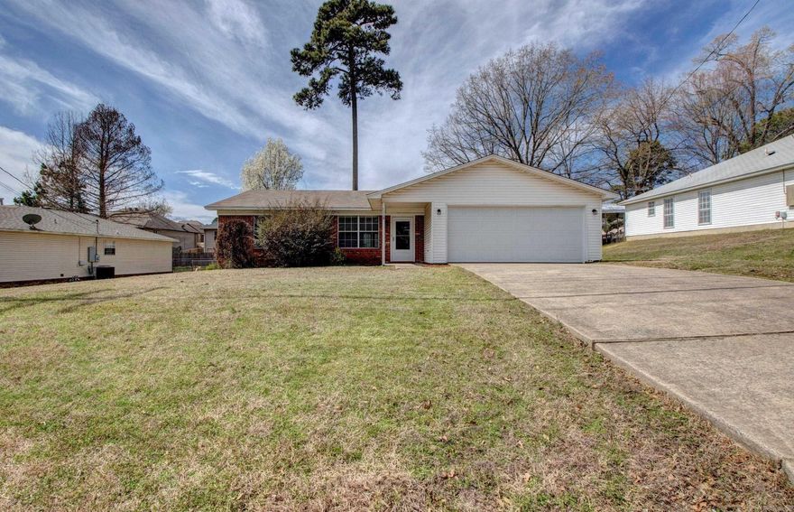 Discover this charming 3-bedroom, 2-bathroom home, perfect for comfortable living. The open-concept living and dining area creates a welcoming space for entertaining, with seamless access to the back patio and a spacious yard—ideal for outdoor gatherings or relaxation. The spacious primary bedroom features a private ensuite bathroom and a walk-in closet for ample storage. The additional bedrooms are generously sized with great closet space. The well-equipped kitchen includes a refrigerator, while the convenience of an in-home washer and dryer adds to the home's appeal. With its inviting layout and thoughtful features, this home is ready for you to move in and enjoy!