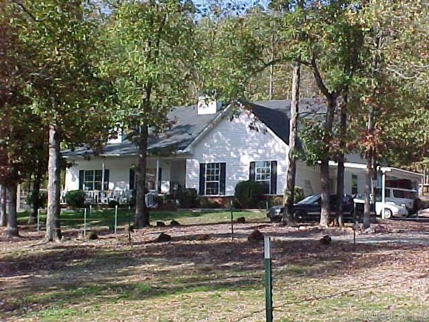 Gorgeous gated estate on 5+ acres just 15 minutes to shopping/restaurants on Chenal.  3 living quarters totaling 4493 SF.  Main house has 2555 SF with 4 bed/3 ba plus bonus room & office.    Guest house has 738 SF with 1 bed/1 bath.  Workshop with 1200 SF has kitchen and bath can be used as residence or workshop.  Bryant Schools and eligible for RD financing.  Don't miss this one!!!