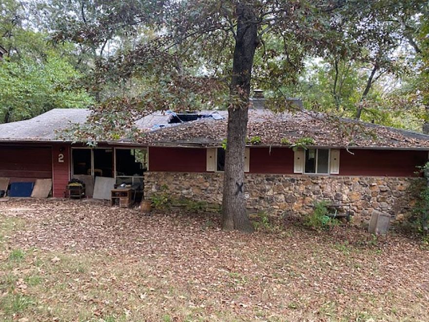 Property being sold "AS IS" - Home has had a fire and is currently unlivable. Property is in a central location near the South Fork River, North Golf Course, Town Center, Lake Thunderbird, Lake Cherokee, plus walking trails, parks, and more. Call the office for complete details.