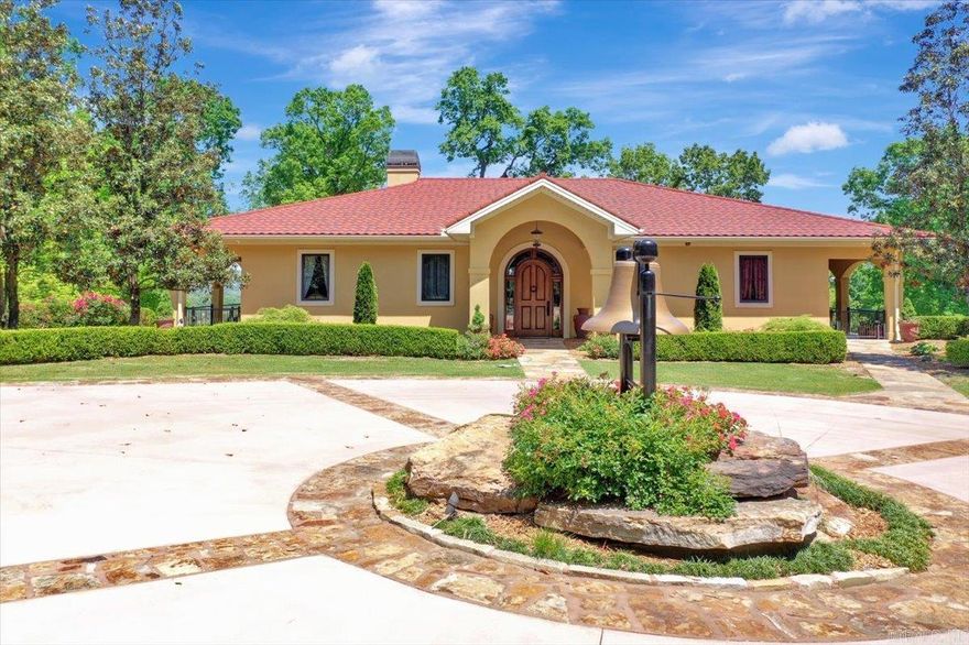 Beautiful doesn't begin to describe this 25 acre private estate. Enter through the new electronic security gate and follow the new asphalt driveway to the breathtaking views that await you above. As if the wooded mountainside, picturesque lawn & landscaping, wildlife, Koi pond with fountain, green house and waterfalls aren't enough, the view from the back terrace spanning all of downtown Hot Springs is truly is something to behold! Particularly at night with all the sparkling lights and occasional fireworks displays! Inside this magnificent 4 bed 4.5 bath home you will find many recent improvements including new kitchen appliances and heat/air units, extra insulation in attic, new tile, paint and much more, along with a new stone coated steel roof in '23. This home and property has lots of storage! Another new feature, built in 2021 is a 40 X 60 temperature controlled metal building/shop with water, septic & 50 amp electrical RV hook ups. New steel roof '23. Security system and cameras installed both at home & shop. Private and secluded yet still so convenient within 15 minutes from Oaklawn Racetrack, lakes, hospitals, shopping and dining. Schedule your tour today. Don't miss out o
