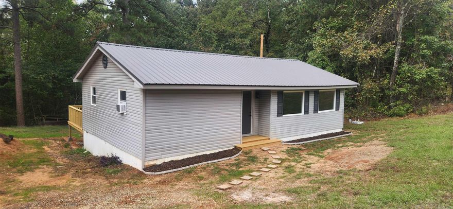 Affordable Renovated 3-Bedroom Home Near Monticello & Star City! Welcome to this fully renovated 3-bedroom, 1-bath home, perfectly located just a few miles from Monticello and minutes from Star City. Every detail has been updated — featuring fresh paint, new windows and doors, stylish kitchen cabinets, modern ceiling fans, lights, and a brand-new metal roof. Step outside and enjoy the spacious 12' x 35' deck, perfect for relaxing or entertaining. This move-in ready home combines modern comfort with a convenient location — all it needs is you!