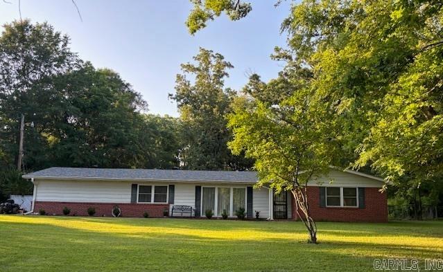 Nice two bedroom, two bath home with large living/dining room, den/kitchen, two-car garage, fenced back yard and a greenhouse. Large front yard.