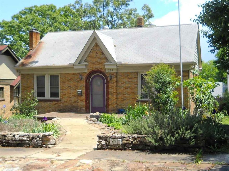 This home offers everything from a touch of the old and the new. Arch door ways, wood and bamboo floors. Updated kitchen, bath and light fixtures. House rewired in 2007, new windows 2008, siding in 2010. Plus oversize 2 car garage (27 X 23), water feature in backyard, granite counter tops. Refrigerator, hot tub, washer, and dryer convey. Hurry and don't let this one get away!