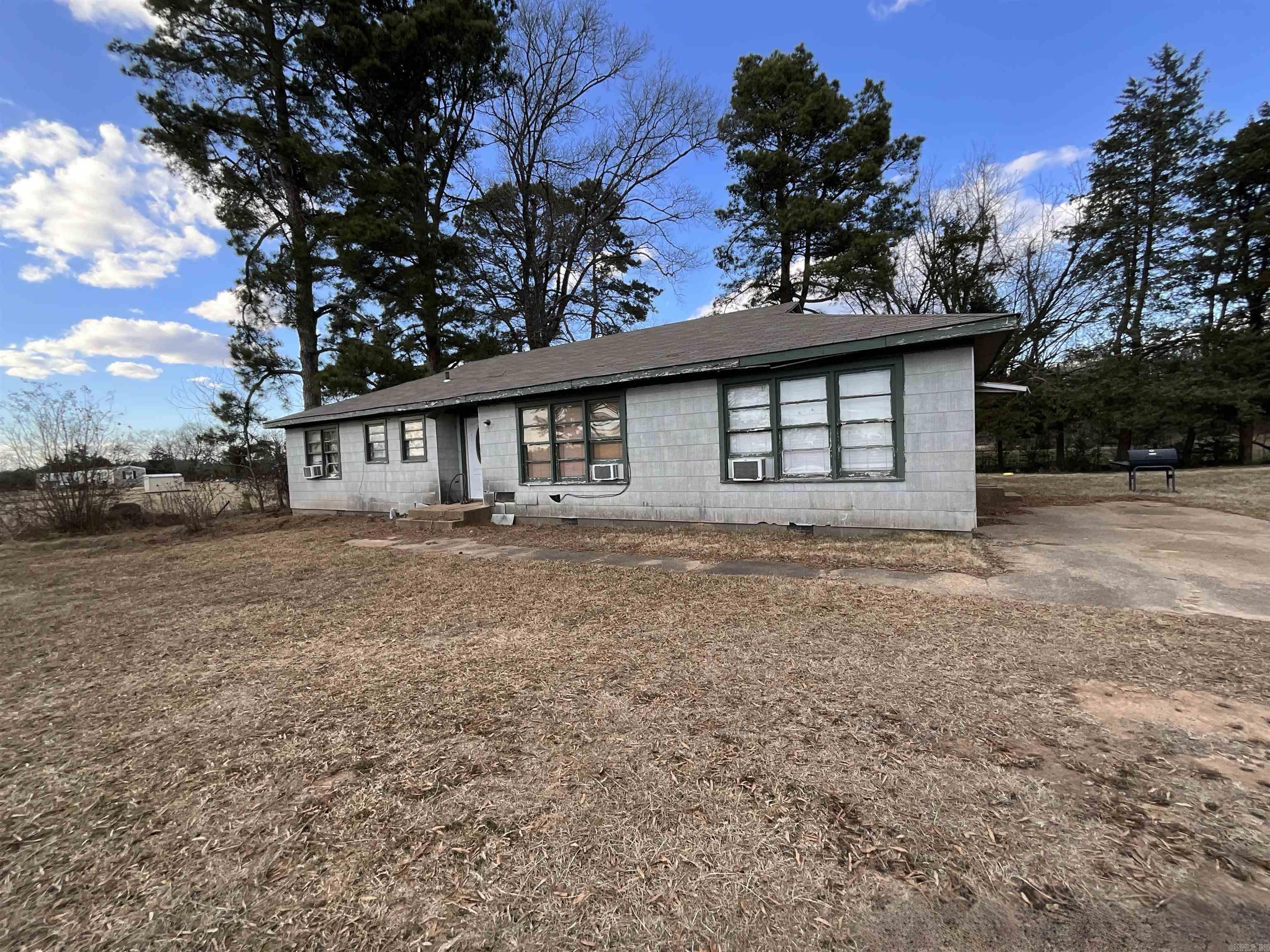 Nestled on a peaceful 1.96-acre lot, this 3-bedroom, 1.5-bath frame home offers a blend of country living and convenience. Featuring a spacious layout, the home boasts a cozy living area, a functional kitchen with ample cabinet space, and comfortable bedroomst. The 1.5 baths provide added convenience, while the expansive yard offers endless possibilities for gardening, outdoor activities, or future expansion. Whether you're looking for a quiet retreat or a place to grow, this property provides a wonderful opportunity to enjoy the beauty of nature while staying close to local amenities. This property is eligible under the First Look Initiative. All owner occupant offers will be responded to after 7 days on the market during the First Look period. All offers must be entered through propoffers.com. All offers are subject to OFAC clearance. A viewing release must be signed and returned to our office before showing the property. See documents. For financed offers EMD to be 1% or $1000 whichever is greater and for cash offers 5% or $5000 whichever is greatest.