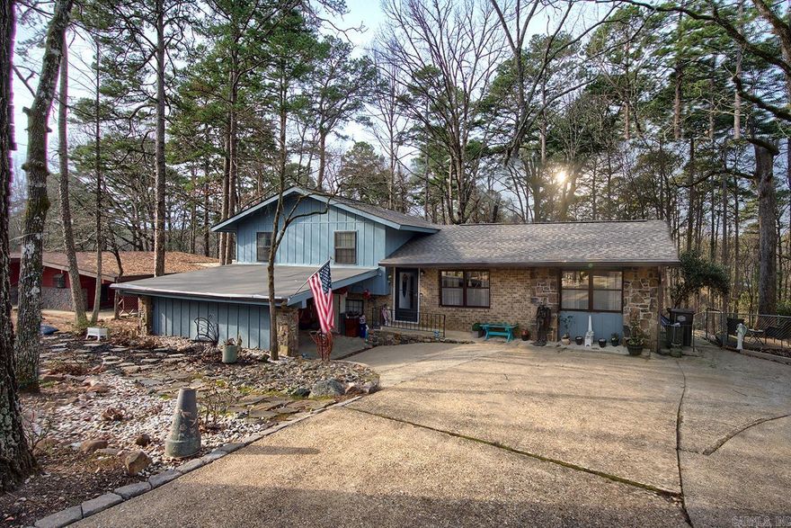Have a growing family or feeling like the Brady Bunch with his, hers and theirs and need a lot of room? This four bedroom plus, split level, 1970s home might be just what you are looking for. Boasting many updates, this affordable home has four full bedrooms, two living areas, an office area, spaces for both formal and informal dining and a workshop. Add to that the beauty and safety of being in Hot Springs Village, and you may have just found your new home.