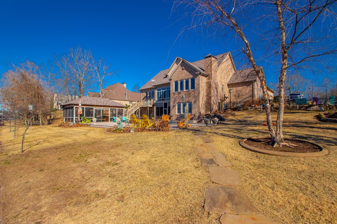 Check out this gorgeous, custom built, luxury lakefront home featuring a fabulous heated pool and whole house generator! This 4 bedroom 4 bath home has 3 living areas, an office, a game room, a beautiful sun room overlooking the lake and even has a beautiful coy pond (fish do not convey). The kitchen is dreamy with all the best appliances and open to a beautiful family room! Multiple entertaining spaces make this home perfect for everyone in the family. Don't hesitate, schedule your private tour today!