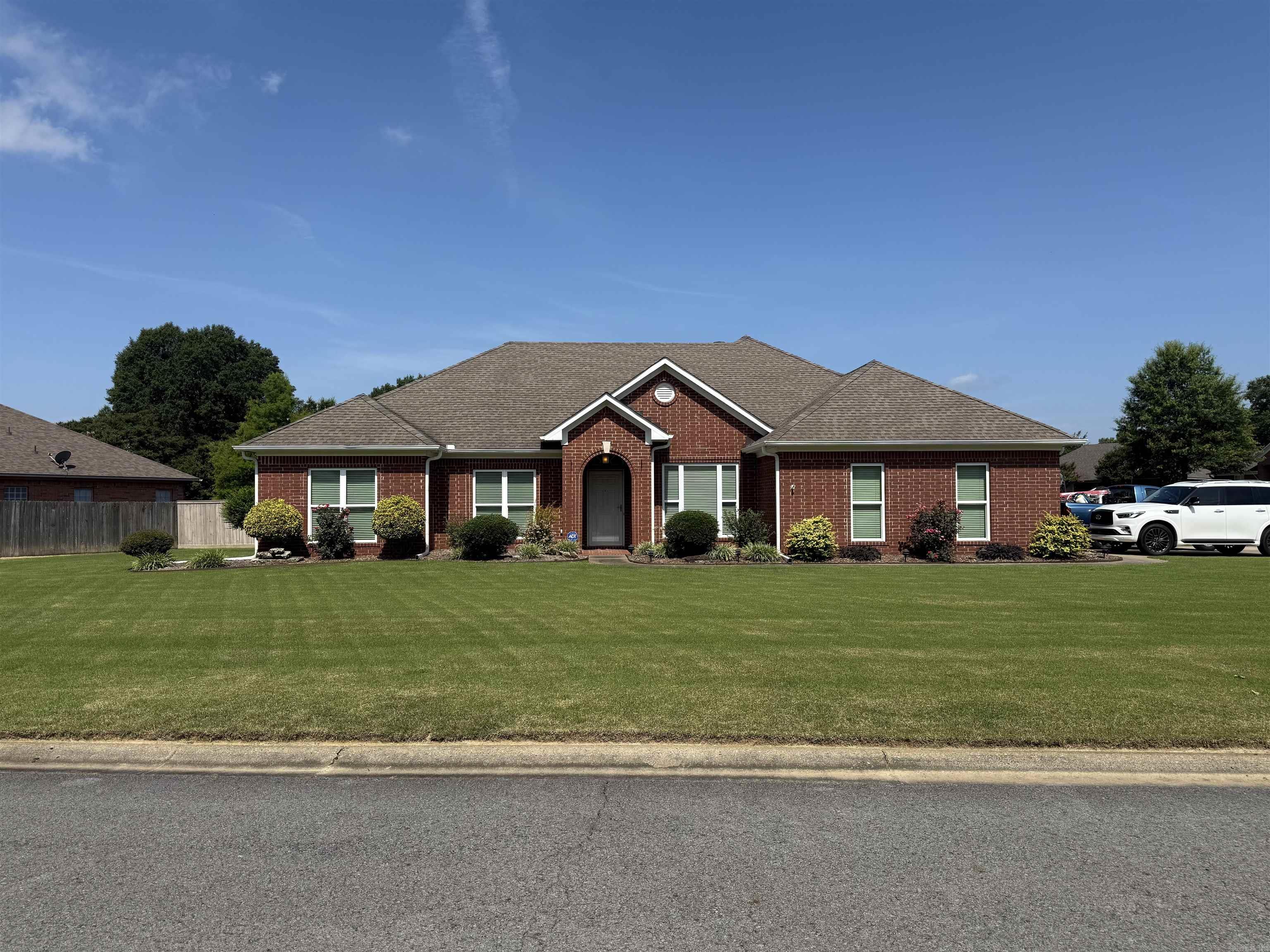 Looking for more space? Look no further...this 4 bedroom 2 bath home has plenty of room for everyone! Located on almost half an acre corner lot, this home features a formal dining room, a large great room with WBFP, wood floors, and custom area for large TV. Updated kitchen boasts granite counters, tile backplash, pot filler, pull outs, drinking water filtration system, pull out trash can and more! Split bedroom plan, spacious master bedroom and remodeled master bath with soaking tub, custom tiled shower, custom cabinets, with built in hamper, ironing board, and more. Laundry room also updated with tons of storage , soaking sink and full counter for folding. In the fully fenced backyard you will find a lg. patio with custom pergola, a 16 x 20 workshop, raised garden beds with irrigation, and more. Schedule your showing today!!