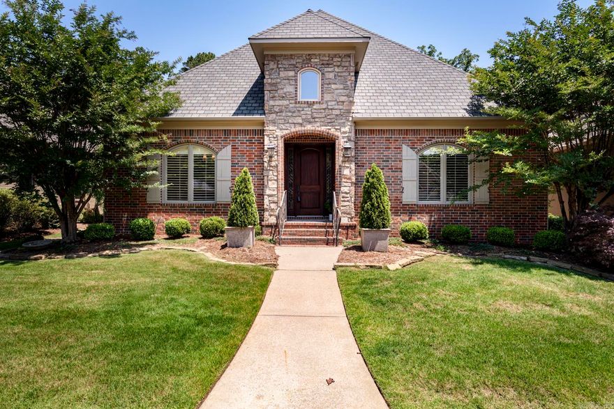Well maintained one level home in the gated Oaks neighborhood where lawns are maintained by the POA. The inviting foyer has slate floors and deep crown moldings. To the left is a Formal dining room with maple floors and a butler's pantry with granite countertops. The kitchen has stainless appliances, a walk in pantry, under counter lighting and abundant cabinetry, a great place to display collectibles and china. A cozy sitting area provides a great place for enjoying morning coffee. The hearth room is open to the kitchen/breakfast area and has a fireplace. Just outside is a covered patio. The primary suite has a walk-in shower as well as a jetted tub and generous walk in closet with safe. There are 2 other bedrooms and one has built-in desk and file cabinets. A powder bath is located of the foyer as well as nice size laundry room with sink. Pretty light fixtures, plantation shutters, security system, walk up attic storage with rear load garage make this home a great place to live. Call today for a showing.