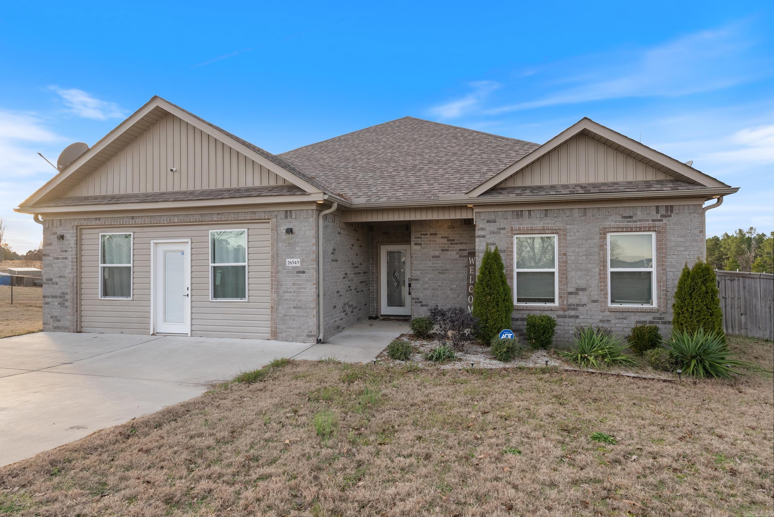 This one-level home is situated on a property where chickens and horses are welcome. It features a split-bedroom floor plan for added privacy and includes hookups for a hot tub. One room is wheelchair accessible, with easy entry from the bedroom into the bathroom. The home is also equipped with extra outlets for a refrigerator, microwave, TV, and more. The garage has been converted into a TV room, providing additional living space. A home warranty is currently in effect for peace of mind. As an added bonus, seller is negotiable to converting the bonus room back into a garage!