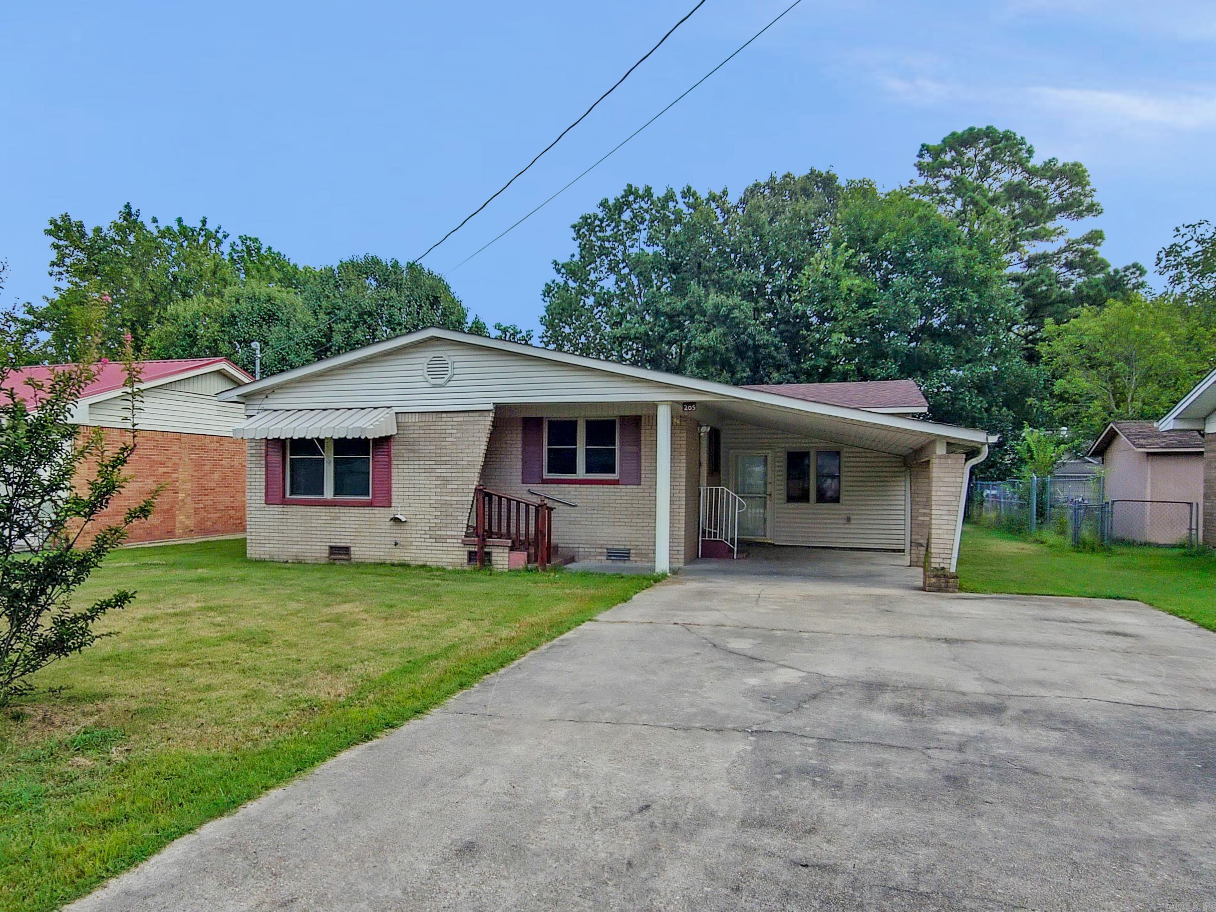 Could be so super cute! This 3-bedroom, 1-bath home is full of charm and character, reminiscent of a cottage or bungalow with its unique roofline (roof looks great too). Step inside to a welcoming living room that flows into the eat-in kitchen featuring a built-in buffet, wall oven, refrigerator, and gas cooktop. The hallway leads to two bedrooms on the left and a retro bath on the right, highlighted by ceramic tub, tile wainscoting, and compact vanity. At the end of the hall, the third bedroom opens through sliding glass doors to a versatile āstep-downā den, game room, or playroom with vaulted wooden ceilings, abundant windows, and acid-stained concrete floors. Outside, the large backyard is fenced with a gate, concrete pad for patio seating, a storage building, and still plenty of space for a garden spot. Bring your toolsāthis home needs a bit of TLC but could make a fantastic rental or a fabulous first home! **Agents - PLEASE read Agent Remarks.