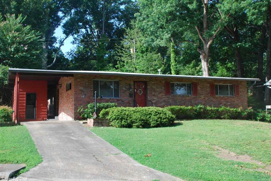 Nice Kingwood Home with beautifully finished wooden ceilings and wall finishes.  Galley kitchen with open flow to the living area.  Vaulted ceilings give the home a nice open feel.  Hardwood floors throughout except for carpet in the den area.  Nice private back yard with cozy patio area off the den.