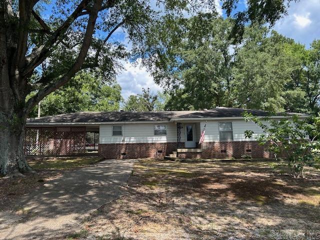 This home is located on three-quarters of an acre of land in the heart of Prattsville. The property is 3 bedroom, 2 bath with beautiful hardwood and tiled floors. It has an enormous living area with a generously sized laundry room that could also be used as a hobby room or an office space. Great outdoor area completed with grilling area, fire pit and metal pergola. There is also a 3 car carport area, and an outdoor shed on a concrete foundation. Both roof and HVAC are about 10 years old. Located in either the Sheridan or Poyen School District-homeowners choice. Come see this house today because at this price it will not last long. Agents see remarks about showing instructions.