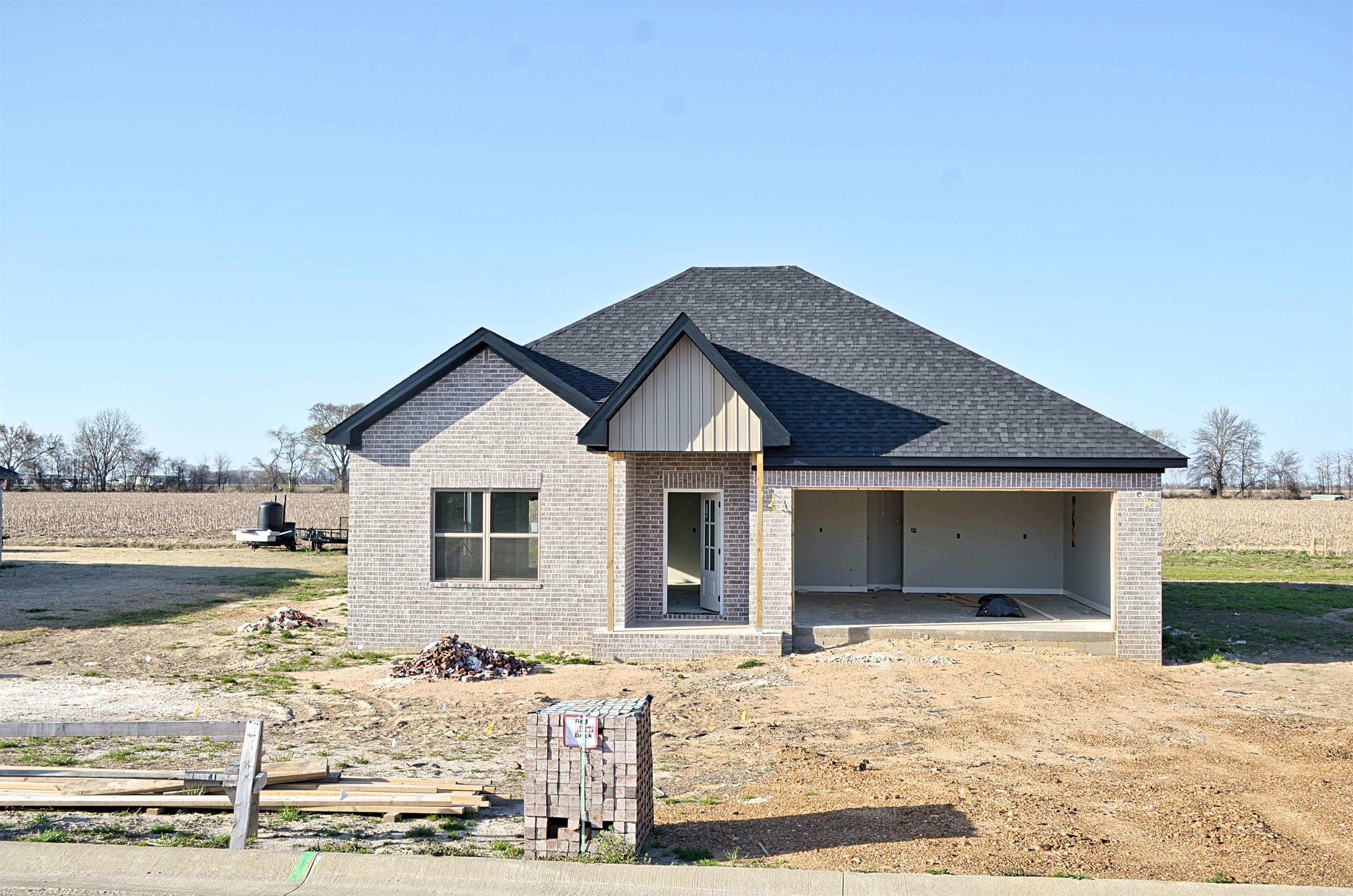 By using the builder's preferred lender, he is offering 5.25% financing to qualified buyers. Welcome Home to Small-Town Charm and Big-Time Comfort! This beautiful all-brick, 3 bed, 2 bath home is nestled in a friendly, established neighborhood where people still wave from the porch and Friday nights are made for cheering on the Wildcats! It's the kind of place where memories are made and neighbors still wave. Step inside and you'll instantly feel the warmth and heart of this home. The open-concept living area is perfect for gathering with loved ones, with a cozy natural gas fireplace ready to keep things toasty on cooler nights. You'll love cooking in the modern kitchen, complete with: Granite countertops. A spacious island with built-in storage. A gas range perfect for those home-cooked meals that bring everyone to the table. The primary suite features a walk-in tile shower & a relaxing soaker tub for those long, well-deserved relaxing baths. Outdoors, you'll be surrounded by other well-kept homes and the kind of neighborhood that invites evening strolls, front porch chats, and a real sense of belonging. It's the perfect blend of peaceful living with a strong community spirit.