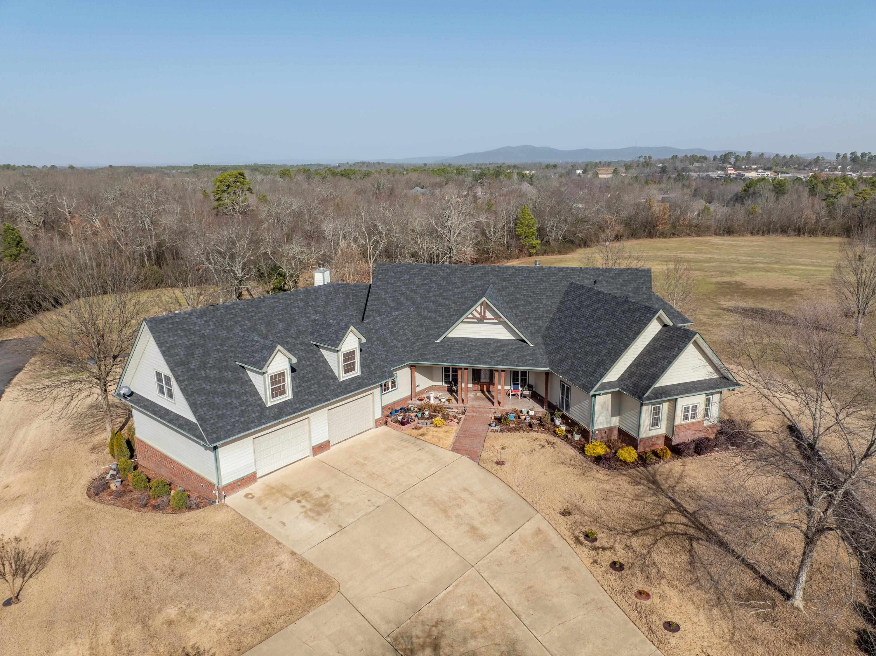 Experience luxury living in this 4,562 sq ft home on 1.5 acres in an established neighborhood. The vaulted great room, filled with natural light, offers stunning views of the pool and the surrounding lovely pastoral landscape that defines this unique community. The kitchen features a spacious island and connects to a breakfast room overlooking the pool. The main floor includes two bedrooms with a Jack and Jill bathroom, and a spacious owner’s suite with an en-suite bath and adjacent room ideal for an office or sitting area. A cozy den with a fireplace provides direct access to the backyard. The four-car garage opens into a hallway with ample cabinetry and an adjacent laundry room. Upstairs, a large fourth bedroom or bonus room with a full bath offers versatile space. Additional updates include a new roof replaced in 2023. This home combines luxury and functionality—schedule your private tour today!