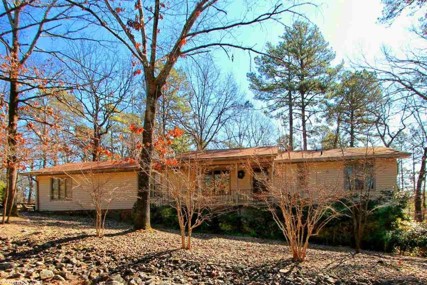 Flat corner lot. 3 bedroom home with a huge Arkansas room AND a bonus room downstairs. Vinyl siding. Fireplace