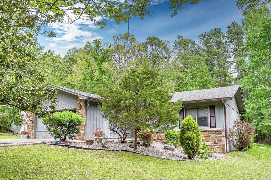 Your favorite number will be 2......This 2 bedroom, 2 bath 2 car garage home offers a wonderful address to call home. Galley kitchen with breakfast nook, living area with formal dining space and Arkansas room. Bonus 10 x 12  storage building to house your yard tools, extra storage or be a workshop. Kitchen has roll out custom cabinets and garden window. Guest bedroom has murphy bed. New roof installed 2025. Whole house fan. Hot Springs Village Property Owner Association has a new member buy-in fee of $2,000.00 due and collected at closing.