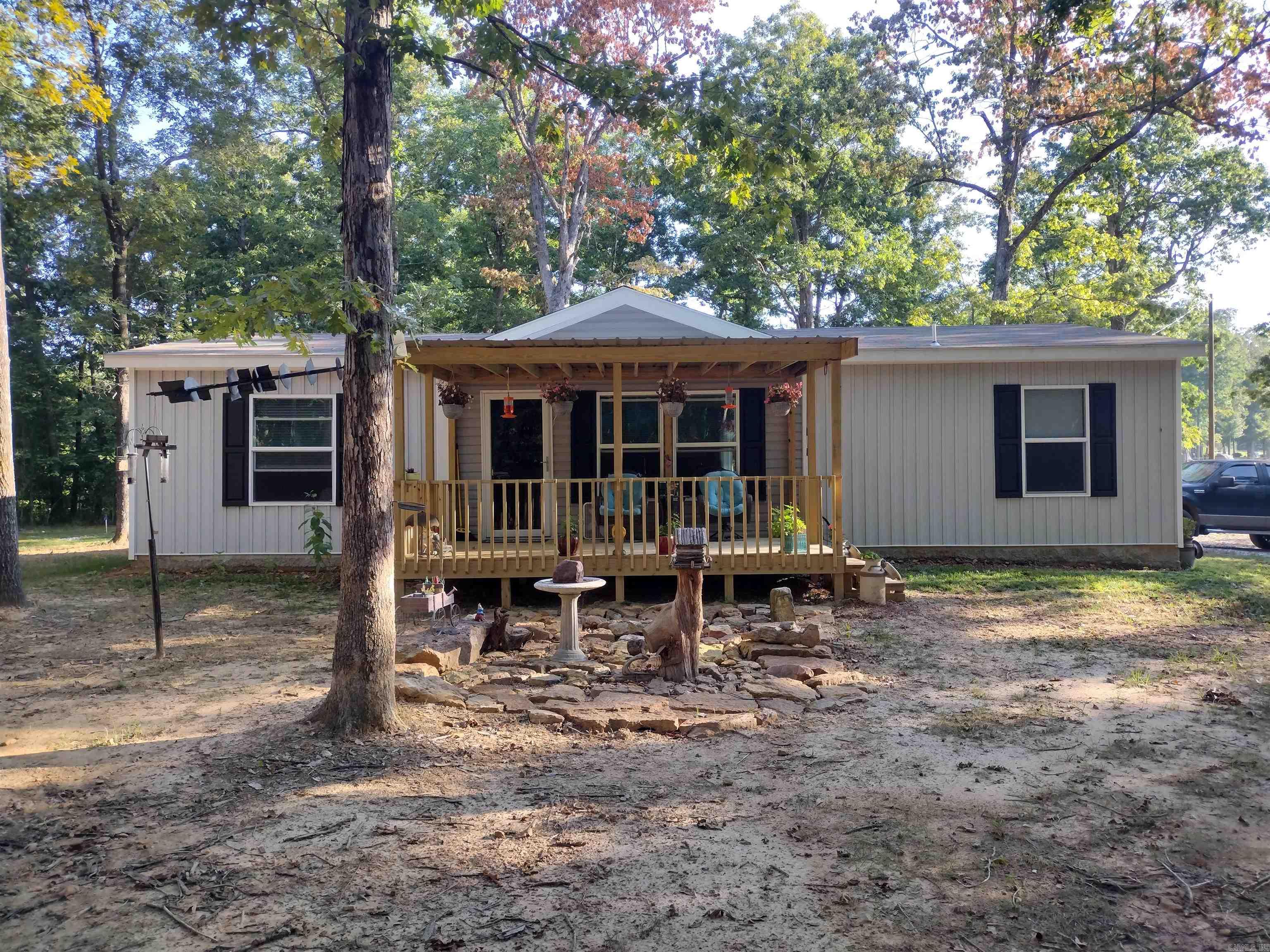 Almost new home sitting on 5.57 acres M/L mostly wooded just 15 Min for Beautiful Mountain View, has 2 porches to set and enjoy the wildlife coming into yard great place to unwind.