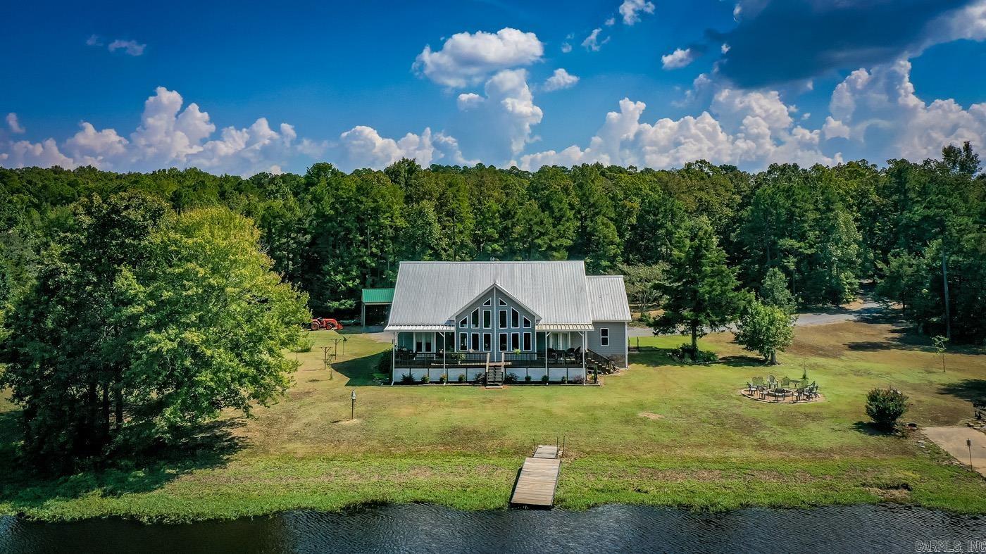 Beautiful Property w/ 14.22 acres +/- (approximately 4 acres of this is located on the other side of the pond & has road frontage on Taylor Rd. that someone could sell off in the future if they chose for another home place).The home was custom built for the current owners by Julian Builders, so a quality built home that includes a 24x30 enclosed detached shop w/a 12x24 carport attached.There are fish in the pond & the sellers own a majority of the pond (one neighbor off of Taylor Rd owns a small portion of it as well).The sellers are looking to downsize, but they have put in a lot of time, work, & money into this beautiful property over the years (it was about $13,000 for them to run city water to the property). It has been very well maintained as this is their full time home since they retired. Main level has split floor plan w/Guest bedroom & full bath on one side of the home & Primary Suite on the other, Kitchen w/separate ice maker, large walk in pantry,custom cabinets, Quartz countertops,& laundry room on 1st floor as well. Upstairs has loft area as gameroom w/wet bar , another guest bedroom & a 1/2 bath. Floored walk in attic upstairs for extra storage. Home is all electric.