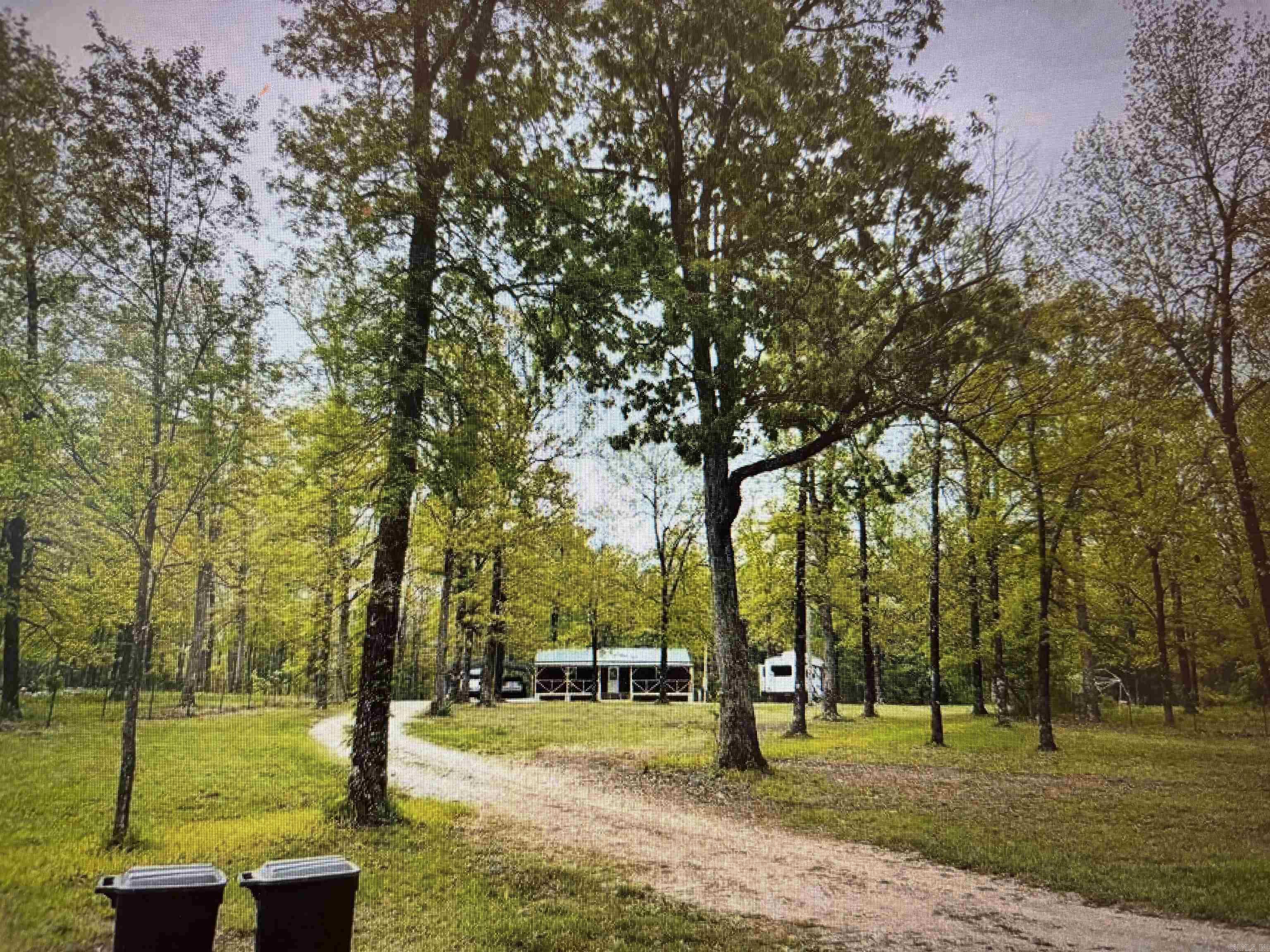 Whether you are looking to purchase a vacation getaway, VRBO property, or place to retire in the beautiful Ozarks, this gorgeous property contains just under 2 pristine acres and is privately located just off scenic AR Hwy 5 just minutes from the music, eateries & shopping of world renown Mountain View! The well-appointed cabin is move-in ready offering a spacious open concept living/kitchen/dining combination & comes fully equipped with all new stainless kitchen appliances, washer & dryer, king size bed, and couch. The beautiful interior is all wood, vaulted ceilings, sliding barn doors, & a large walk-in shower with glass doors. The covered porch across the front and the back are perfect for morning coffee & enjoying peaceful evening breezes. Private septic system, public water, 2 car carport, storage building, framing for additional outbuilding, as well as set up for 2 RV's: 30 & 50 amp plugs with septic and water. This lovely property is truly perfect for a couple, retirees, a vacation or second home, or for use as a VRBO. Great price! Great location! Move in ready! Why wait? Call today!