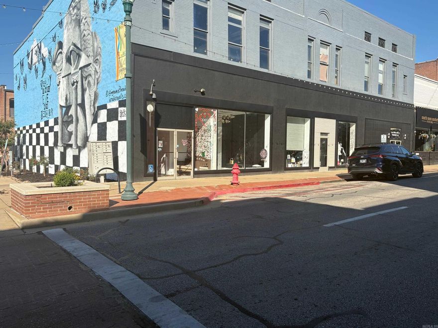 Discover an exceptional investment opportunity in the heart of historic downtown Jonesboro with this versatile commercial building for sale! The street level of this 3 level building features 17 offices, (mostly renovated), renting for $400-$600 per month utilities included, offering a steady income stream. Alongside the offices is a charming boutique store, also available for sale as a business, with an estimated rental potential of $2,500 per month. The back salon on the ground floor, equipped with modern amenities, is poised to rent for approximately $800 per month. The 6,700+/- square foot basement boasts a newly renovated restaurant space with updated ceiling tiles, flooring, countertops, and bathrooms, leased for $5,000 per month with utilities included under a new 3-year term; the restaurant handles renovations and maintenance and is fully handicap accessible. The top floor, currently vacant, presents endless possibilities, perfect for event rentals, a small bar, or even an Airbnb, and could be split into multiple units to maximize rental profits. This multi-purpose property combines historic charm with modern upgrades, making  Property located in opportunity zone.