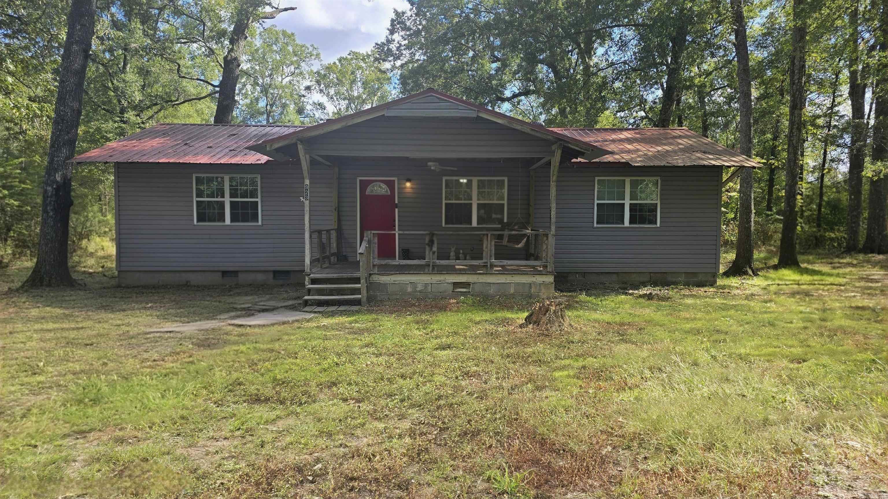 Welcome to your new home - a 3 bed, 2 bath home o 2.07 acres. This home offers: newer Water Heater, newer Septic Tank, Flooring, Paint, Windows, Plumbing, Stainless steel Appliances, updated Bathrooms. Six year-old metal roof. The matching LG Washer and Dryer Appliances can covey with accepted offer. Don't miss this one11 Call and schedule a tour to view this property.