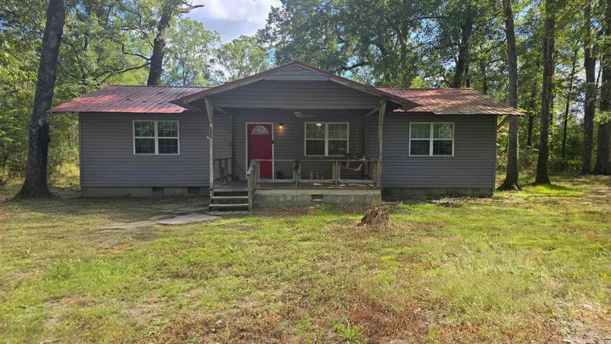 Welcome to your new home - a 3 bed, 2 bath home o 2.07 acres. This home offers: newer Water Heater, newer Septic Tank, Flooring, Paint, Windows, Plumbing, Stainless steel Appliances, updated Bathrooms. Six year-old metal roof. The matching LG Washer and Dryer Appliances can covey with accepted offer. Don't miss this one11 Call and schedule a tour to view this property.