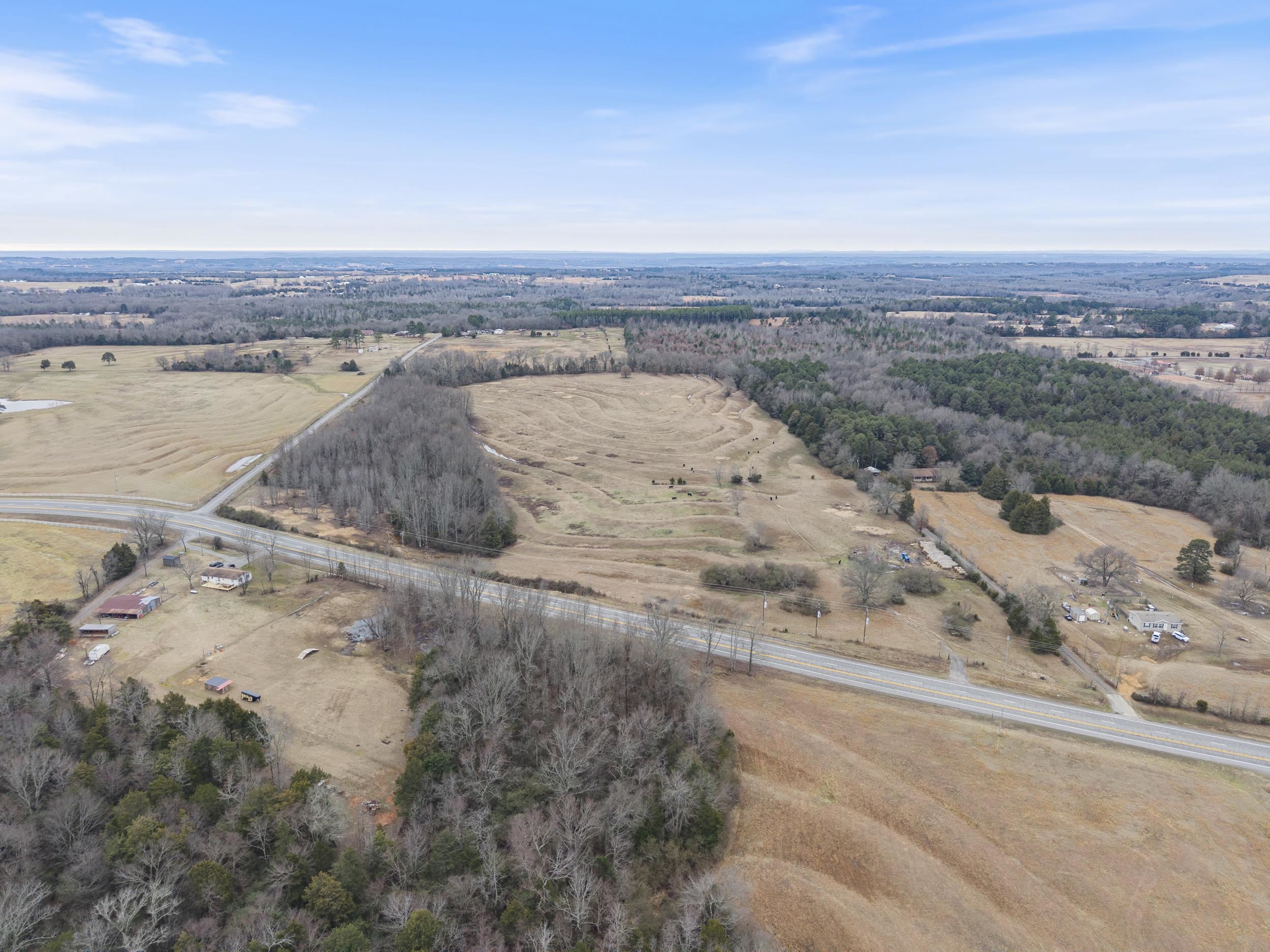 Prime Land Opportunity! Discover an incredible piece of land with highway frontage on Hwy 25, offering exceptional visibility and access in the heart of Guy! This property sits only one parcel down from the Guy-Perkins Schools and is fully fenced for livestock. This property boasts a rich history as an old homestead, with a storm cellar and a water well likely still on-site. Utilities are available at the road - this land presents endless possibilities—whether you envision a thriving commercial development, a high-traffic retail space, or a charming residential subdivision. Its high traffic count to the lake makes it an ideal investment for future growth. Mineral rights convey! Don’t miss this rare opportunity to own a versatile and highly desirable piece of real estate in a prime location! Call your favorite agent today for more details. Agents, see remarks.