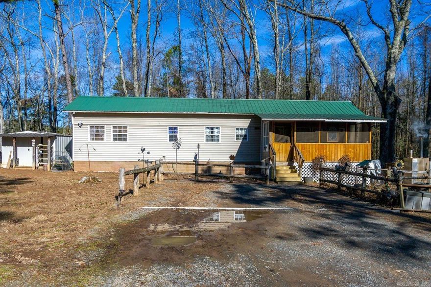 Welcome to your perfect retreat from the hustle and bustle of modern life! This charming tiny home offers a unique opportunity to embrace minimalistic living without sacrificing comfort or style. This property provides the ideal setting for those seeking a simpler, more sustainable lifestyle.  Situated on an expansive 3-acre lot, the property includes a large barn, along with a Grilling Station, workshop & clubhouse for the kids! Whether you're relaxing by the tranquil creek, tending to your garden, or simply soaking in the natural beauty of the landscape, you'll find endless opportunities to connect with nature right at your doorstep.  Inside the home, you'll find a thoughtfully designed living space that maximizes every square foot for functionality and comfort.  Don't miss your chance to experience the joy of tiny home living in this idyllic setting. Schedule your private showing today and start living your best life in this cozy retreat!