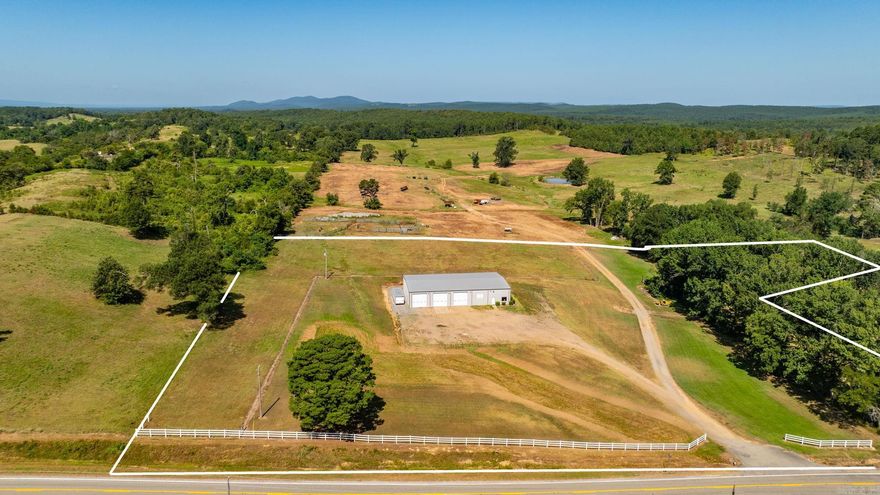 Exceptional Commercial Opportunity on 6.22± Acres in Houston, AR! This 6,000 sq ft fully heated and cooled metal building is steel-framed, heavily insulated, and features 6" thick concrete floors—ideal for heavy-duty use. The structure measures 60' x 100' and includes three oversized garage bays perfect for RVs, plus a separate single-car garage bay on the side. Inside, you'll find a private office, restroom, and kitchenette with a sitting area, along with lofted storage above the office. This versatile space is perfect for RV or boat storage, classic car collectors, race car maintenance, or light industrial use. With over 6 acres of land, there's plenty of room for expansion or additional development. Conveniently located off Hwy 216 with easy access to nearby cities. Endless potential for business or hobby use! Also listed for land use MLS #: 25031089