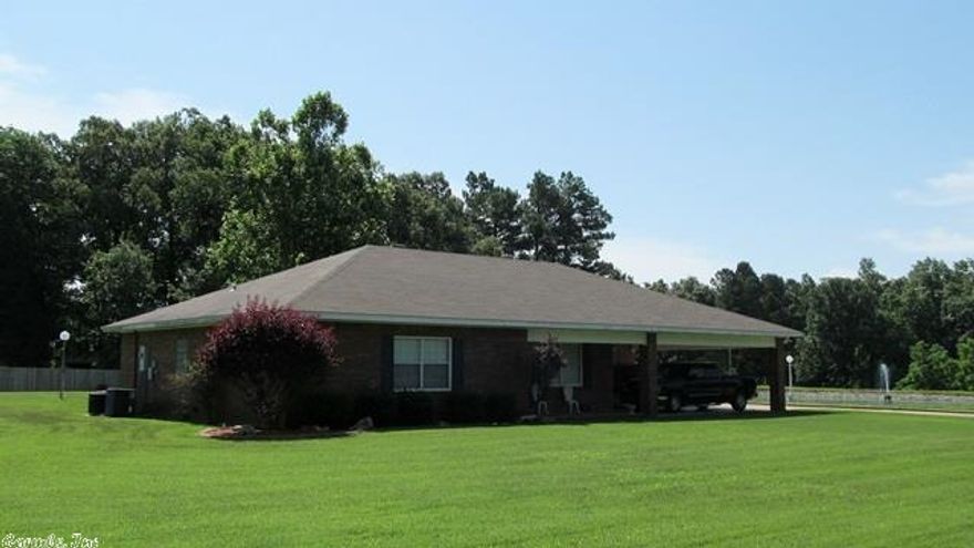 Fabulous property loaded with features! Spacious rooms throughout and lots of closet space. Two generously sized master suites each with very large walk-in closets. There is a separate dining room, a breakfast area, and two large living areas for easy entertaining.  The den has a beautiful view of the pond which features a dock and a water fountain in the center. This home also comes with two acres and a 30 x 39 workshop. An additional 1 acre can be purchased for $17,500.