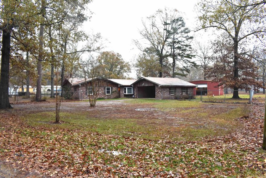 New To The Market! Don't sit on this well maintained 3-bedroom 1.5 bath home that sits on 1 acre fully fenced property with a large 24x36 shop in the backyard. This is perfect for a starter home or small family wanting country living with a small neighborhood feel.  Enjoy sitting in front of your woodburning stove during cold weather or on your back patio during warmer weather.
