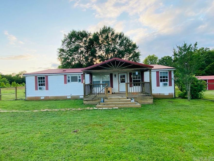 This charming 3-bedroom, 2-bath home sits on a spacious 1-acre lot in a quiet neighborhood. This home offers a fenced in front yard, a covered front and back porch, a carport, a storm shelter and much more.  Come see this beautiful home today!