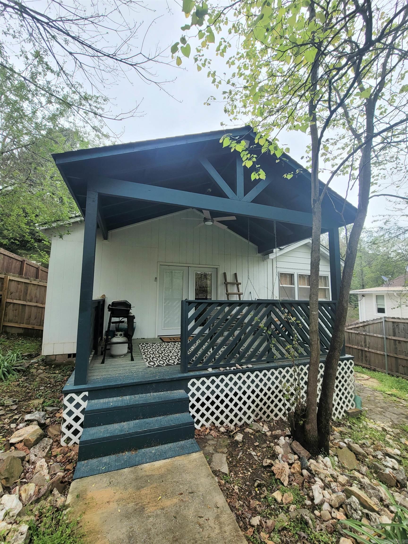 Active Airbnb! Start your business today by purchasing this little money making machine. STR license transfers upon purchase by filling out a few documents at the city. This gem is nestled in the hills off Park Ave and located near the National Forest with several mountain biking and walking trails minutes away. The home offers tons of attractions within 10 miles of its location which includes downtown Hot Springs, bath house row, Oaklawn Race Track and Casino, and lots of tourist stops along the way. The property has been completely updated and furnished with all the things guest love when staying at a home away from home. The property has a great backyard with firepit and a large covered deck for all those great BBQ memories. You will love the extra living room area and coffee cart which just add to the charm of the house. Don't miss this one as it pulls in plenty of cash flow to pay all expenses and turn a profit. Schedule today and be one of the few to have a short term rental in city limits!