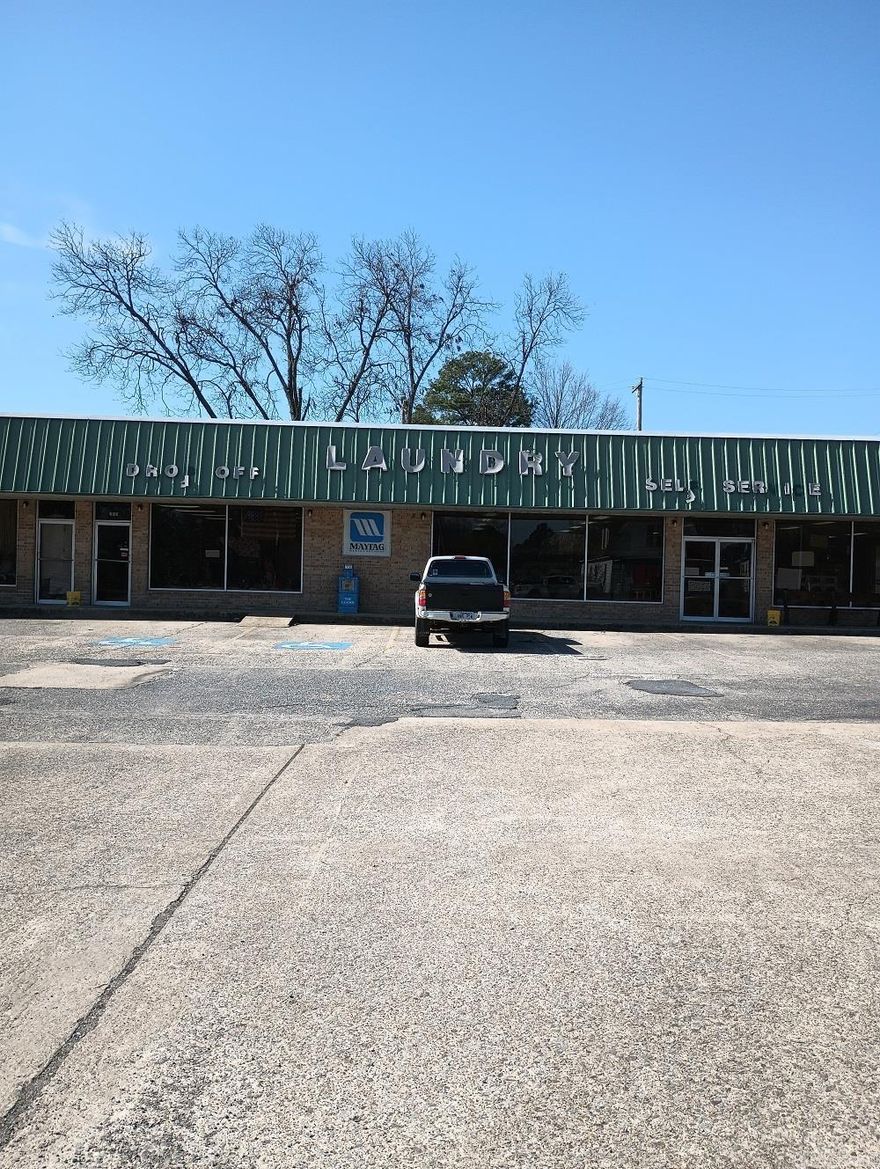 INCOME AND EXPENSES ARE ESTIMATED. AGING LAUNDROMAT WITH EXTRA STORAGE ROOM WITH OVERHEAD DOOR. ON CORNER LOT AT W LOCUST AND N 2ND STREETS IN CABOT, ARKANSAS. METAL ROOF, CITY SEWER, NATURAL GAS,