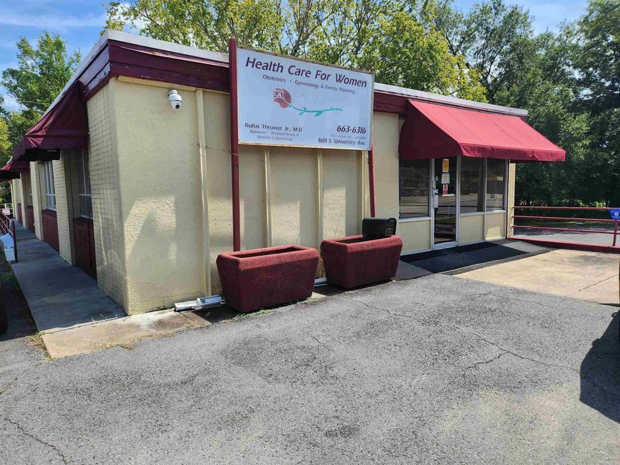 This property consist of 2 parcels. The building is on 1 parsel with about 7 parking spots.  The lot next door has about 10 spots and green space.   Currently a medical office, it would make a great officce, retail, child care, executive office.  4 bathrooms.